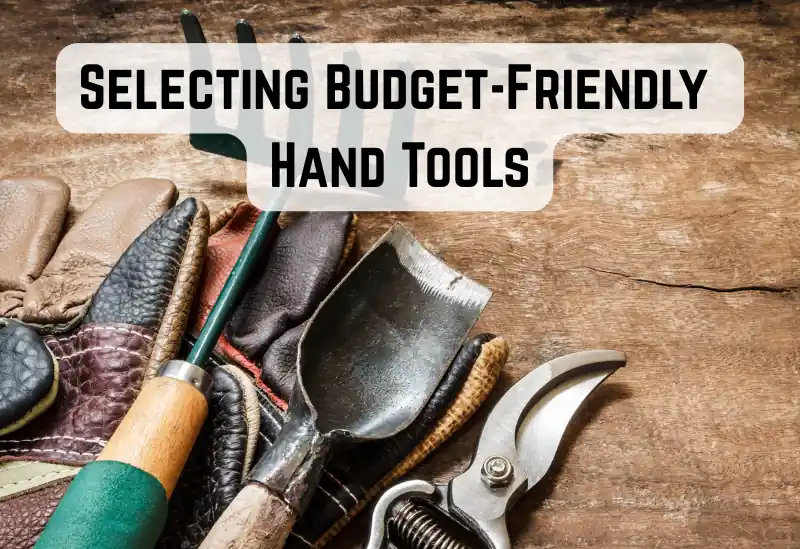 Budget-friendly hand tools for gardening, including a trowel, hand fork, and pruners laid out on soil