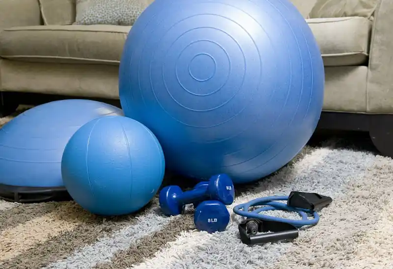 Home fitness equipment set up on a living room floor