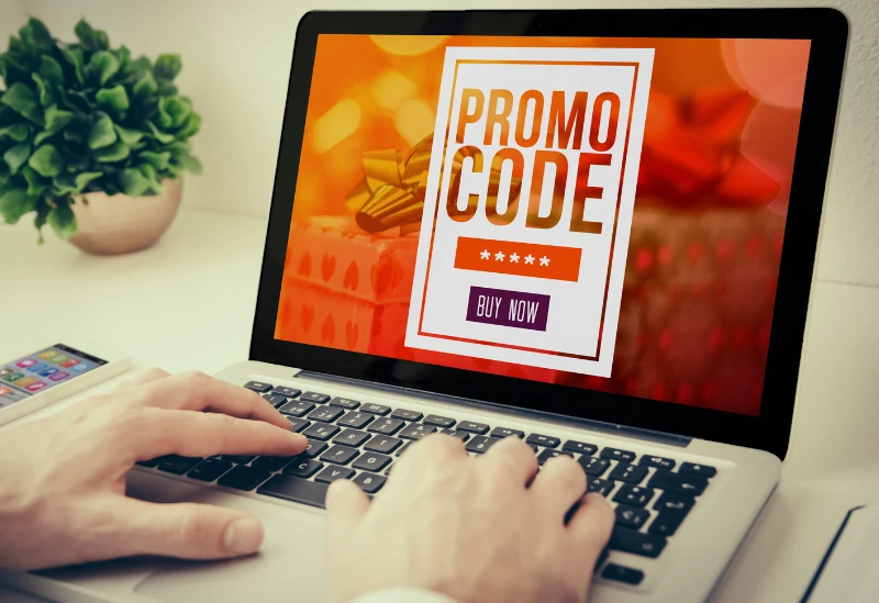 Laptop showing discount codes for craft supplies