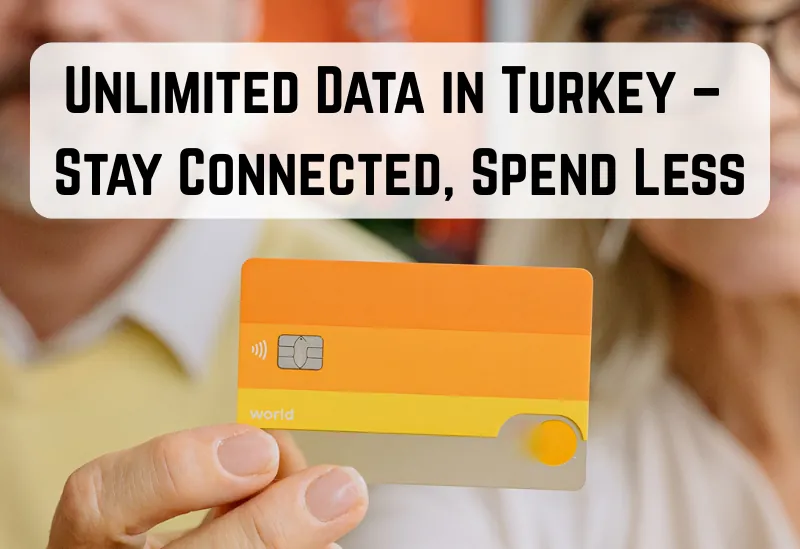 Couple working remotely on laptop at a café in Istanbul holding an eSIM card.