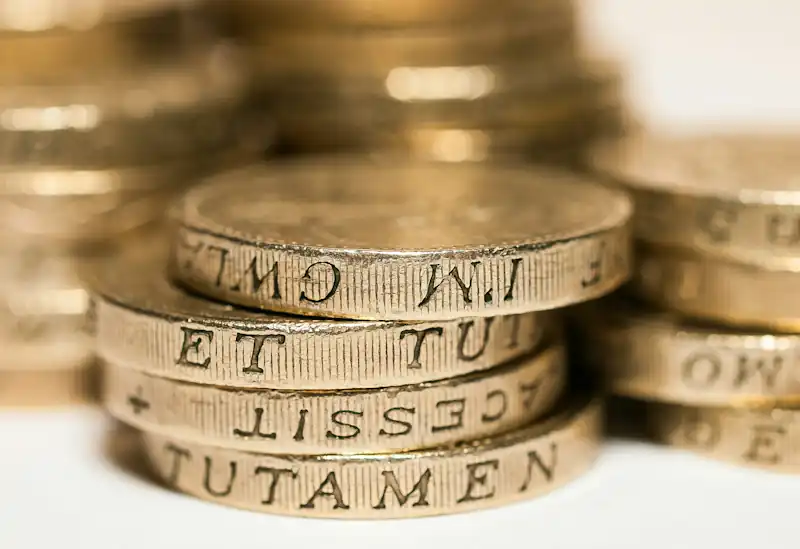 Stacked British one‑pound coins.